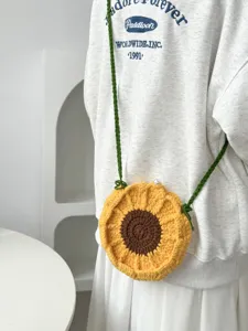 Handmade crochet sunflower shoulder bag, cute floral crossbody design for women daily style.