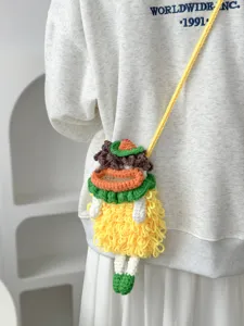 Handmade crochet cute doll crossbody phone bag detailed view showing fine yarn texture.