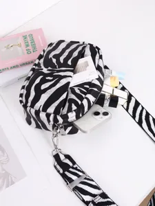 Zebra print PU leather crossbody bag interior detail showing large capacity and thick strap.