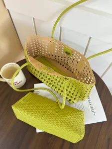Green woven leather tote bag with matching pouch, stylish summer shoulder handbag for women.