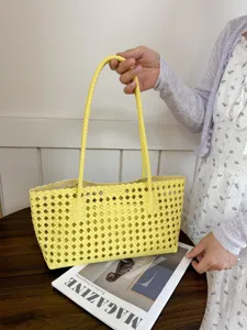 Yellow hollow woven tote bag, stylish summer commuter shoulder bag with double handles.