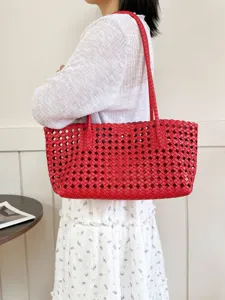 Chic red woven leather tote bag for women, stylish large capacity shoulder commuter bag.