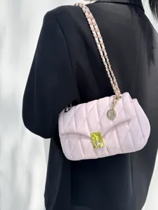 Chic pink quilted chain shoulder bag, stylish crossbody bag detail showcasing elegant hardware.