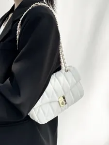 Detailed view of the elegant quilted shoulder bag with chain strap and chic design.