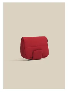 Red quilted mini bag detail, compact pouch with flap closure and metal ring accent.