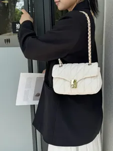 Elegant white quilted chain shoulder bag for women, chic crossbody bag with luxury gold lock.