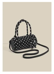 Black and white polka dot cylindrical handbag detail, sweet style crossbody shoulder bag.