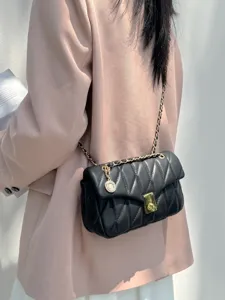 Chic black quilted chain crossbody bag for women, elegant faux leather small square shoulder bag.