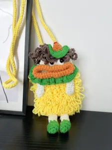 Handcrafted crochet cartoon crossbody phone bag with cute big mouth design and wool knit.
