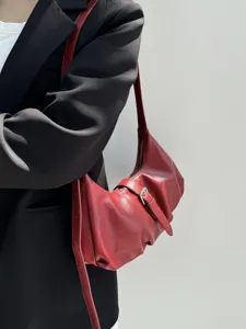 Minimalist Korean style red leather shoulder bag for women, chic commuting dumpling crossbody.