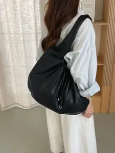 Stylish black pleated slouchy shoulder bag for women, trendy hobo handbag for daily commute.