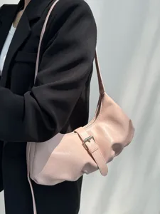 Stylish pink shoulder dumpling bag for women, minimalist design, high-quality material for daily commute.