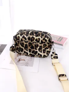 Leopard print crossbody bag with wide strap and zip closure for women daily use.