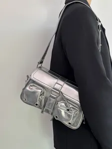 Metallic silver motorcycle shoulder bag detail shot, featuring multiple pockets and metal hardware.