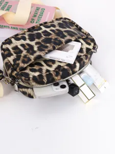 Leopard print PU leather crossbody bag with zipper closure and practical daily capacity.