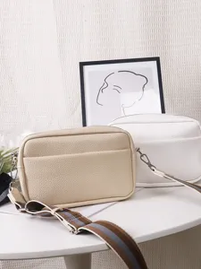 Detail view of solid color PU leather crossbody shoulder bag for women, versatile small square bag.