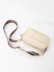 Beige PU leather crossbody shoulder bag for women, featuring striped strap and silver hardware.