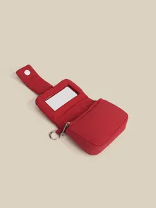 Red quilted mini lipstick pouch handbag with built-in mirror and zipper for daily fashion wear.
