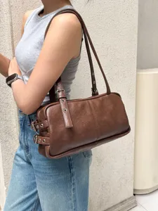 Retro brown Boston shoulder bag for women, chic vintage PU leather underarm handbag.