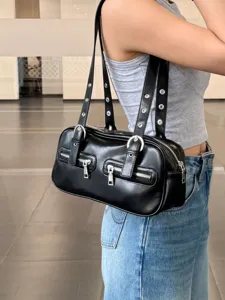 Detail view of black vintage bowling shoulder bag with dual straps and front zipper pockets.