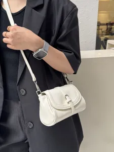 Retro minimalist white shoulder bag, elegant small crossbody bag for daily commute and style.