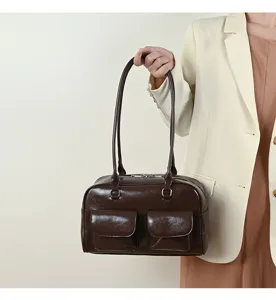 Retro brown shoulder bag for women, large capacity college style casual tote handbag.