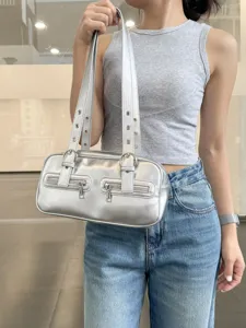 Metallic silver shoulder bag for women, retro bowling handbag with dual straps and pockets.