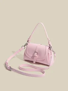 Pink leather shoulder bag detail, stylish flap design with metal buckle and adjustable strap.