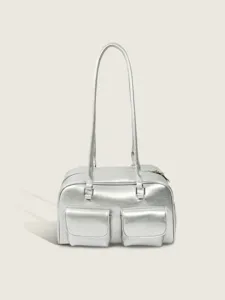 Silver metallic shoulder bag with dual front pockets, stylish retro commuter handbag.