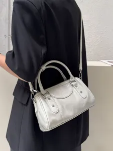 Chic leather Boston shoulder bag for women, stylish crossbody bowling bag with top handles.