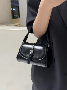 Black glossy retro shoulder bag for women, trendy minimalist messenger bag for daily commute.