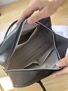 Black retro women shoulder bag detail showing large capacity interior compartments and lining.