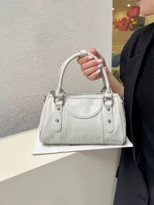 Light gray PU leather Boston shoulder bag, stylish commuter handbag with metal hardware.