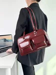 Vintage patent leather shoulder bag for women, large capacity casual commuter handbag.