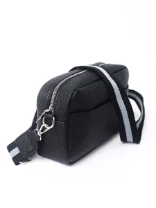 Close-up detail of black PU leather crossbody bag featuring silver zipper and striped strap.