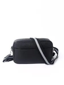 Detail view of black PU leather crossbody bag with striped shoulder strap and metal hardware.