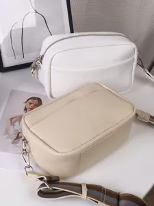 Stylish solid PU leather crossbody bag for women, versatile chic shoulder square bag daily use.