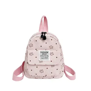 Pink corduroy mini backpack with cute floral and dot print for women daily casual outdoor use.