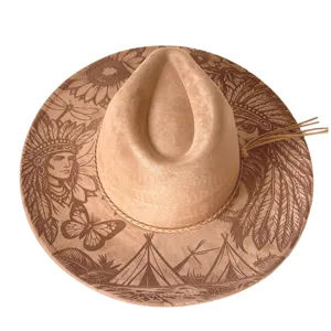 Laser engraved tribal pattern western cowboy hat detail showing intricate boho suede fedora design.