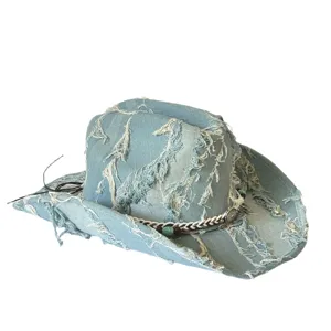 Distressed denim cowboy hat detail, vintage western style with frayed edge and braided band.