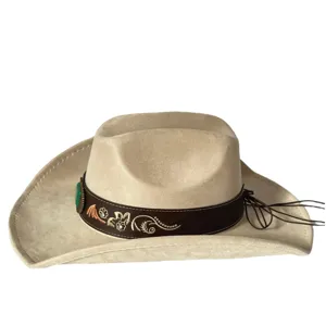 Close-up details of the vintage western cowboy hat featuring floral embroidery and turquoise.