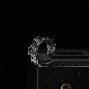 Detail shot of vintage punk motorcycle gear silver ring, gothic open adjustable men jewelry.