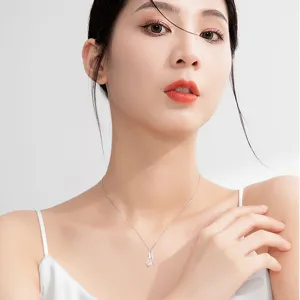 Elegant silver couple necklace with magnetic pendant, perfect minimalist jewelry gift for her.
