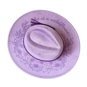 Purple suede fedora hat with laser-engraved daisy floral pattern and western cowboy style.