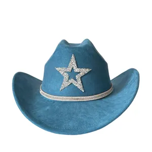 Close-up detail of blue suede western cowboy hat with sparkling rhinestone star and shiny band.