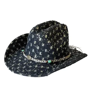 Detailed view of a vintage distressed denim western cowboy hat with sequins and turquoise beads.