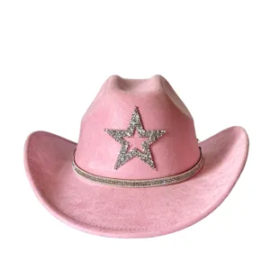 Pink suede western cowboy hat detail featuring sparkling rhinestone star and matching band.