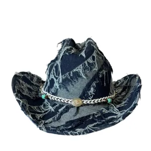Distressed denim cowboy hat featuring frayed edges and a decorative braided hatband with metal concho.