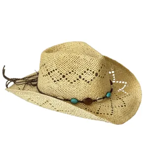 Detailed view of the hollow braided straw cowboy hat featuring bead and shell decoration.