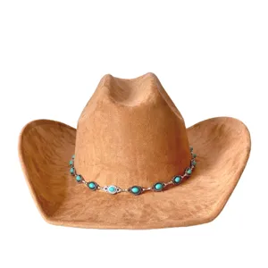 Brown suede western cowboy hat detail featuring a vintage silver turquoise stone hatband.